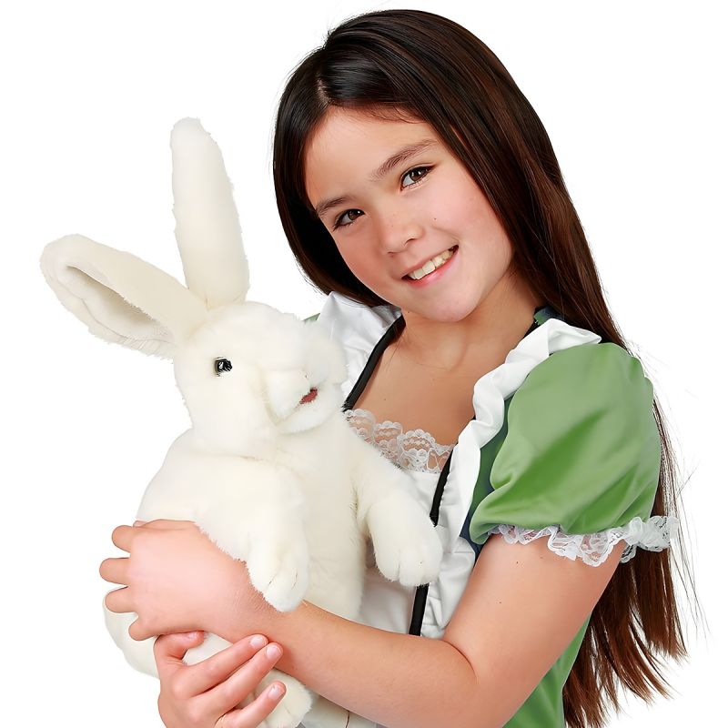 Girl holding the Folkmanis white standing rabbit hand puppet